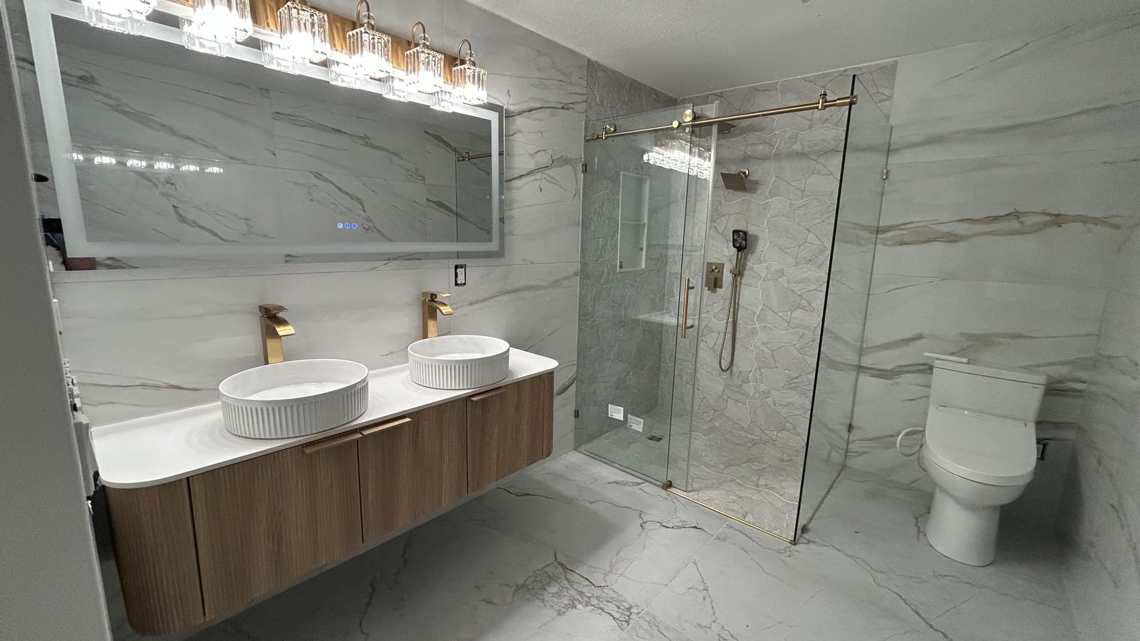 Double vanity bathroom with frameless glass shower